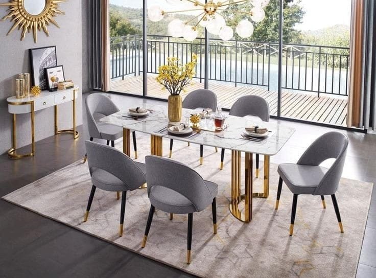 Celeste White Marble Dining Set – 6-Seater with Gold Legs & Grey Chairs Celeste White Marble Dining Set – 6-Seater with Gold Legs & Grey Chairs